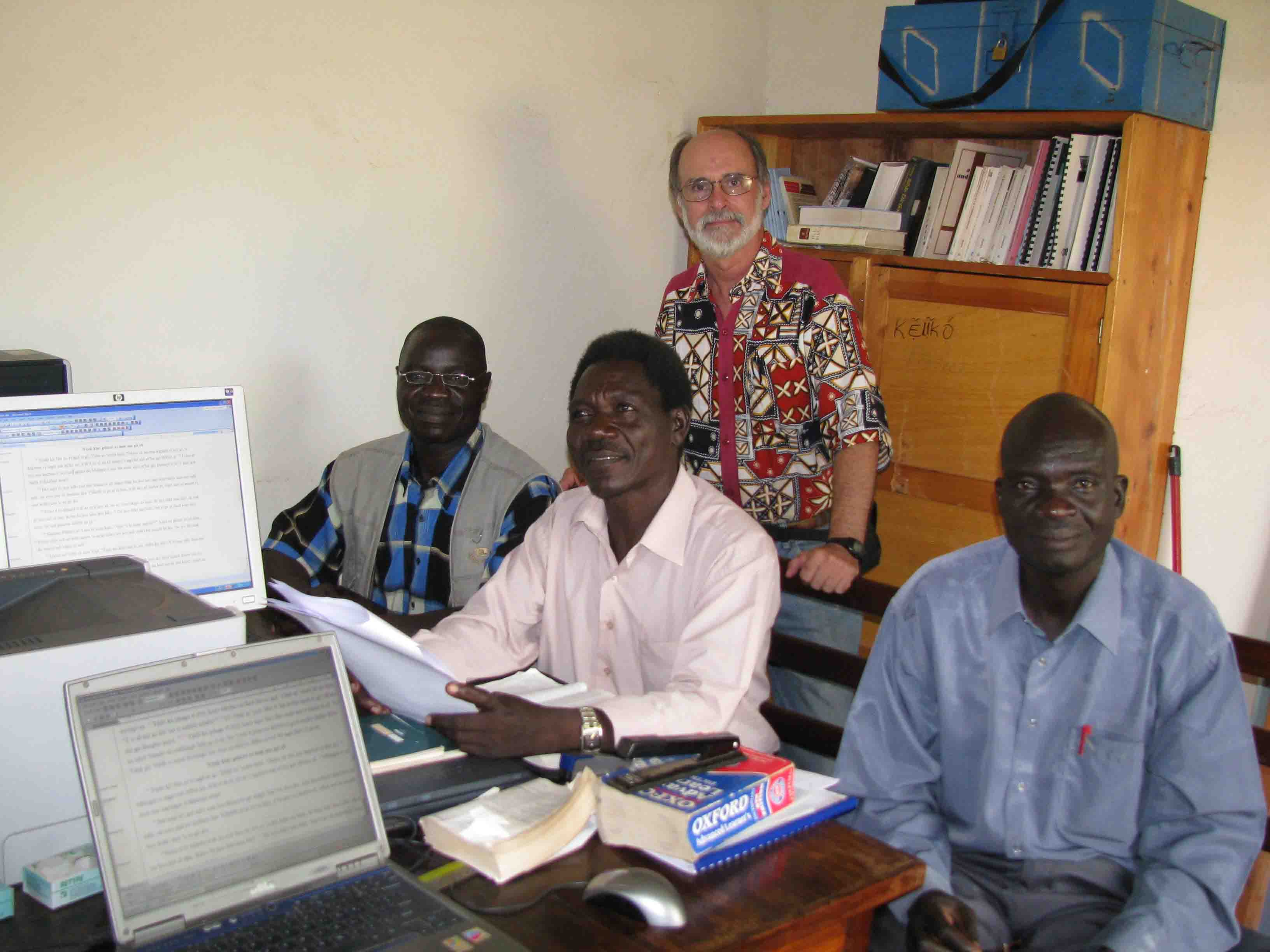 Consultant Wes Ringer helps check the Book of John with the translation team